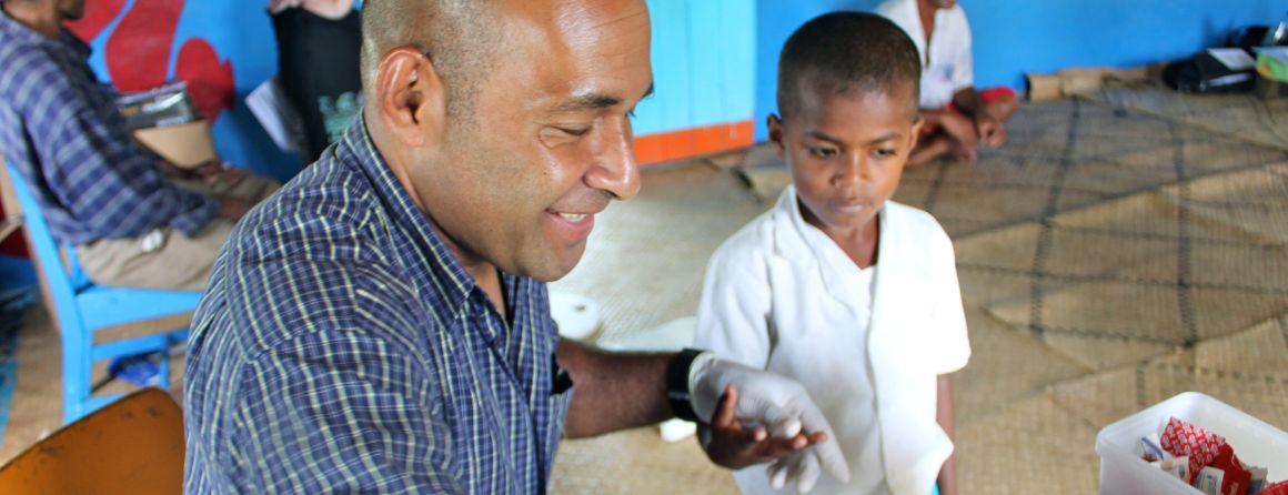MCRI researcher giving child scabies treatment