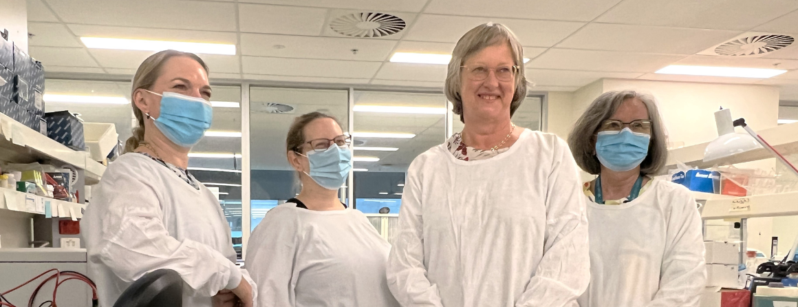 Professor Julie Bines and 3 women in her lab