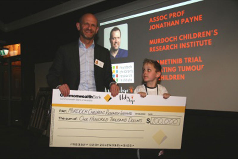 Winner receiving a giant cheque