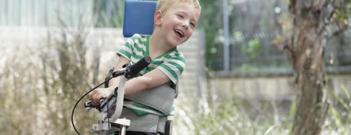 Young boy with cerebral palsy on a bike