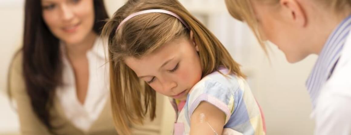 Girl being vaccinated