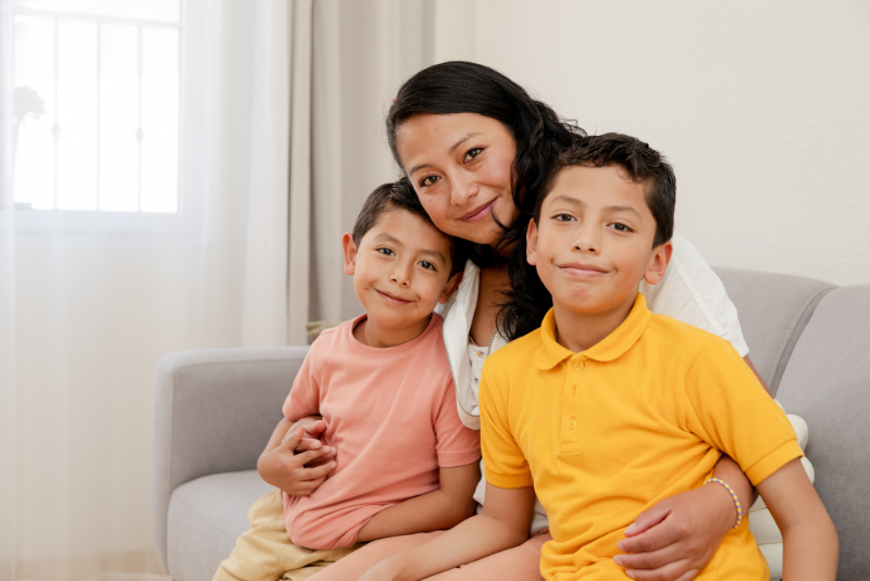 Mother and children smiling at camera