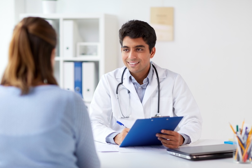 A doctor speaking to a patient