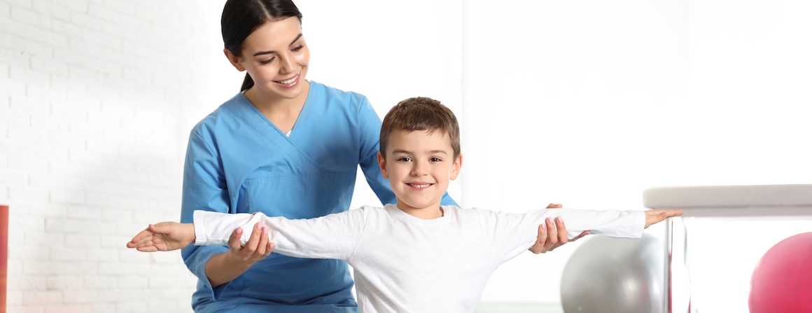 A child with a physiotherapist