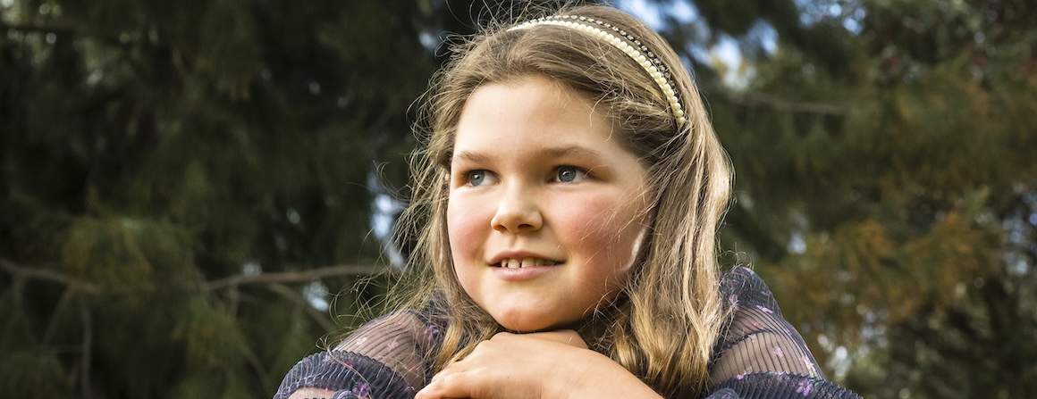 A girl leaning on a railing