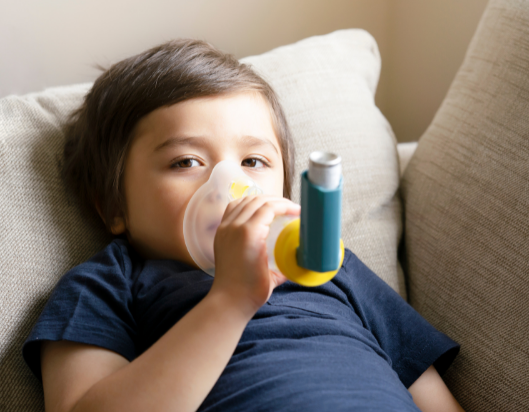 Child using an asthma puffer