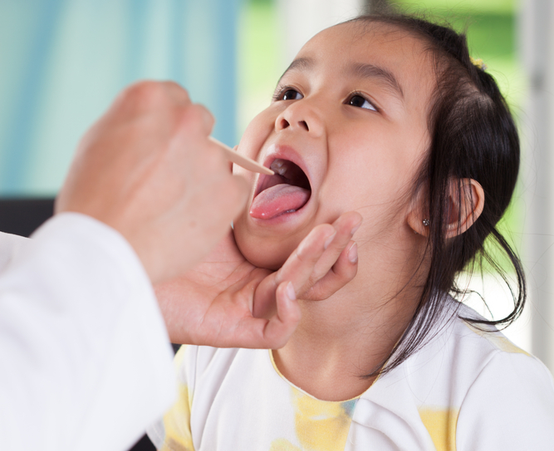 Child getting throat checked
