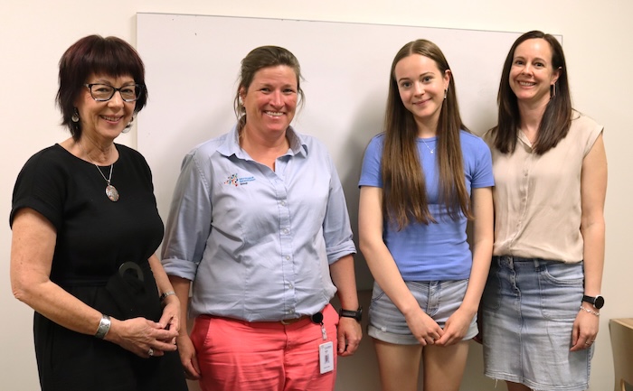 MCRI Prof Vicki Anderson, physio Katie Davies, Macy and her mum Jo at the clinic
