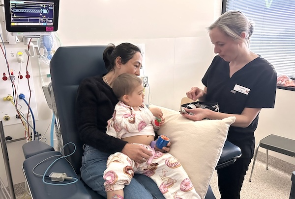Maddie with mum Lucy and Comfort First clinician Jess