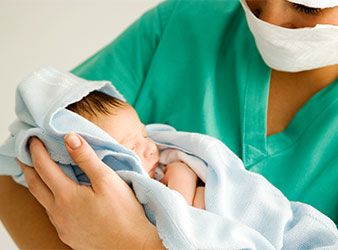 Nurse holding a baby