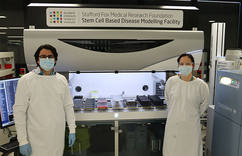 Researchers in front of the Disease Modelling Facility
