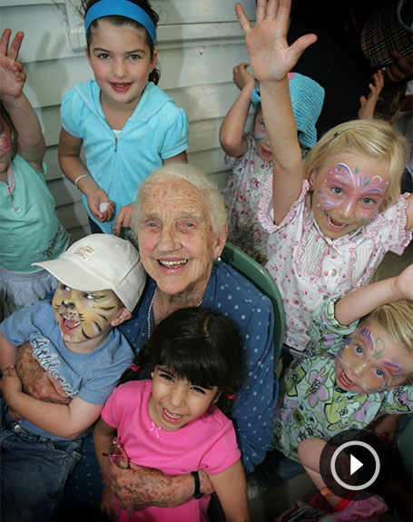 Dame Elisabeth Murdoch AC DBE with a group of children