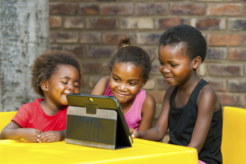 Children learning on laptop