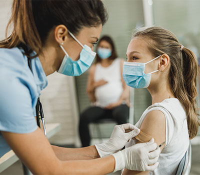 Teen receiving vaccination