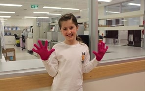 Grace wearing pink gloves